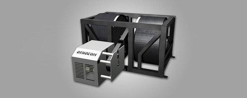 Dynocom 2WD 30,000 Series chassis dynamometer with twin 48-inch rolls and eddy brake on grey studio background
