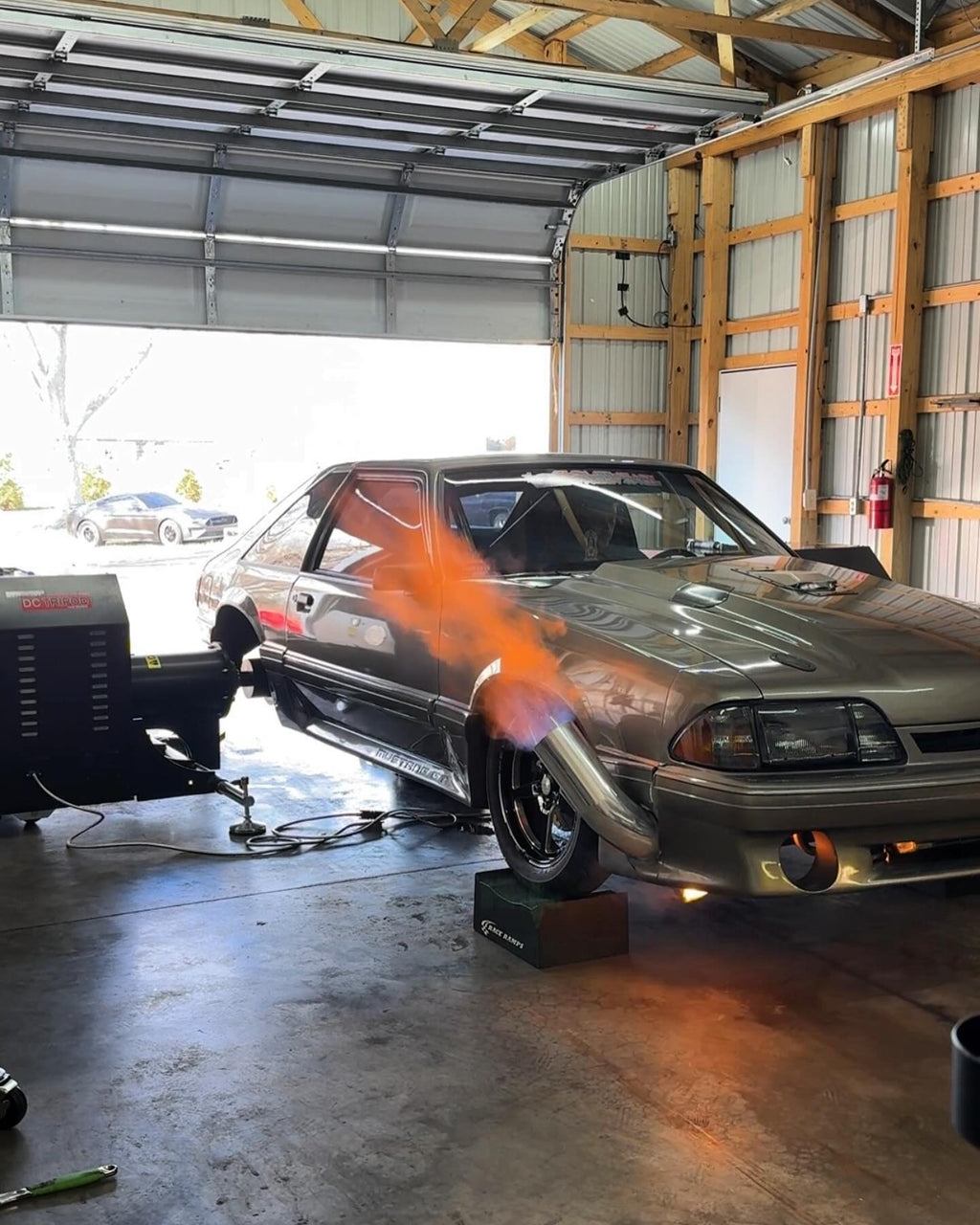 Dynocom DC TriPod in use with Fox Body Mustang firing flames on dyno