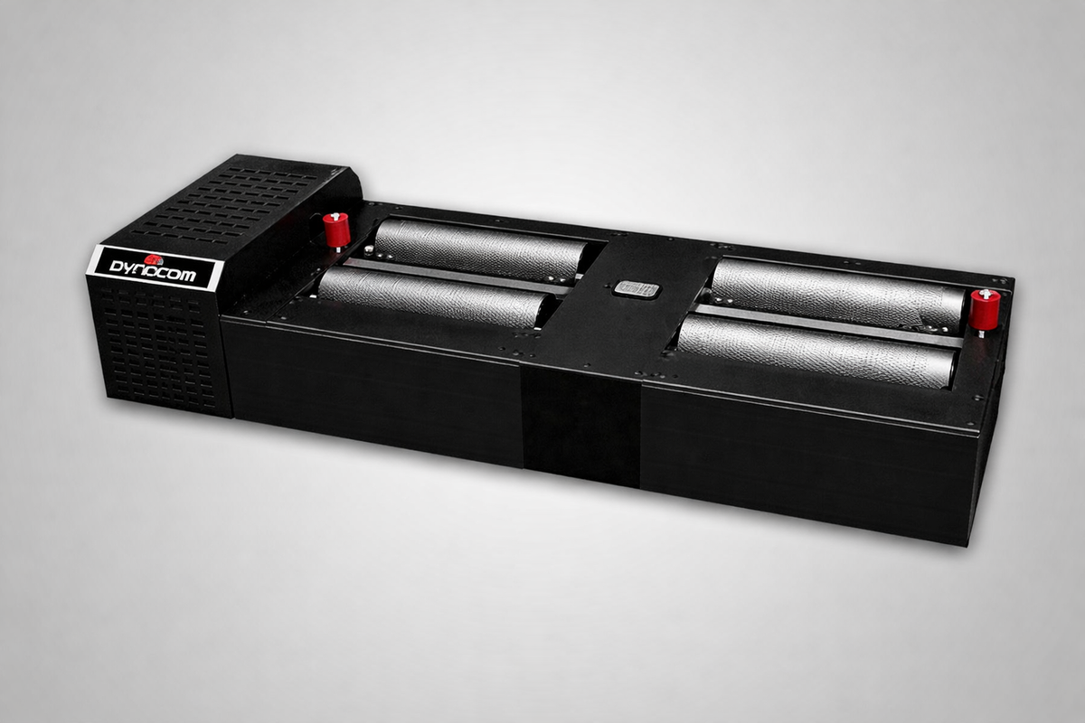 Dynocom 2WD 5000 Series 8.75 inch cradle roll dynamometer with knurled rollers on grey background