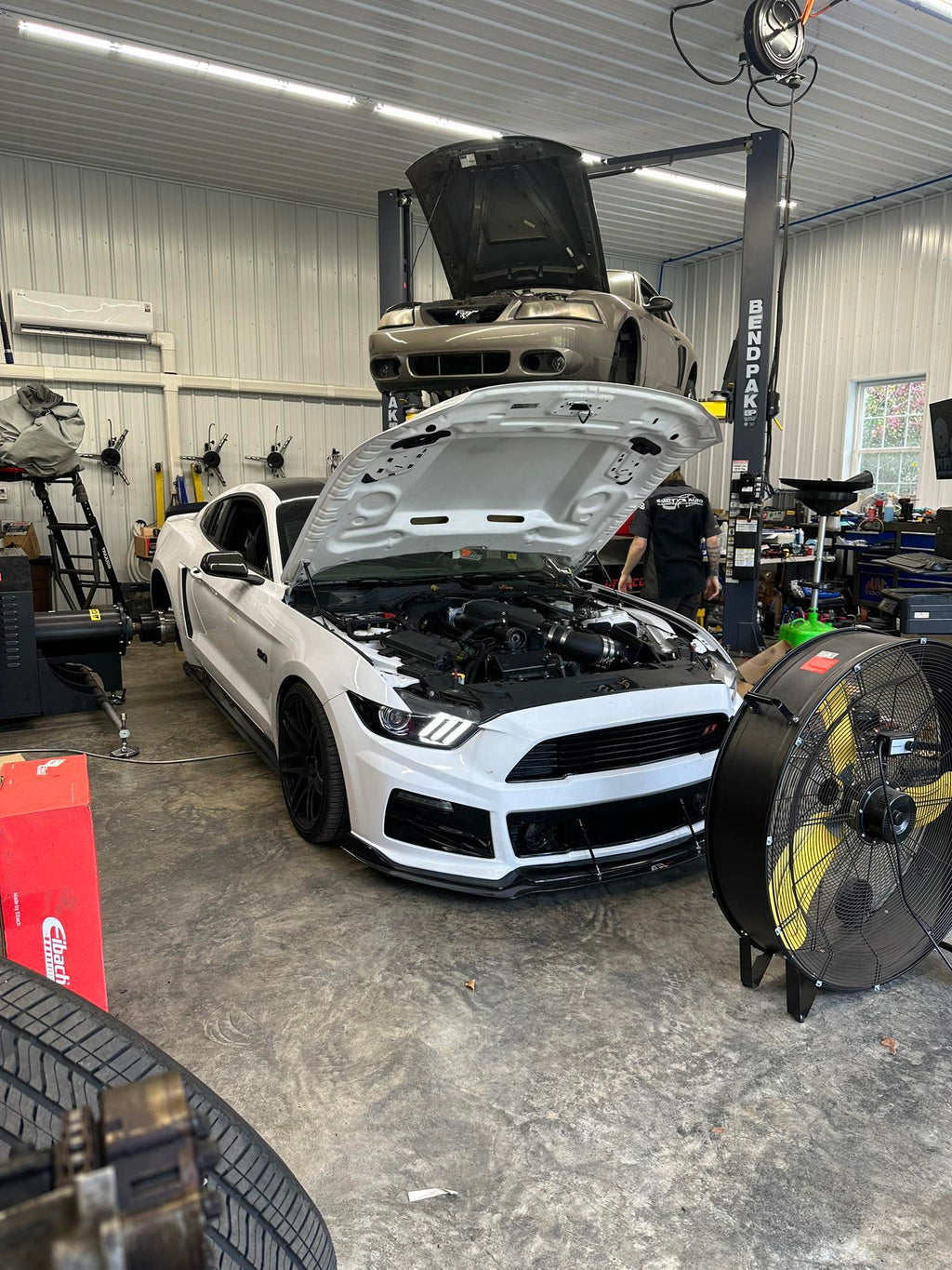 Dynocom DC TriPod testing white Mustang in professional performance shop