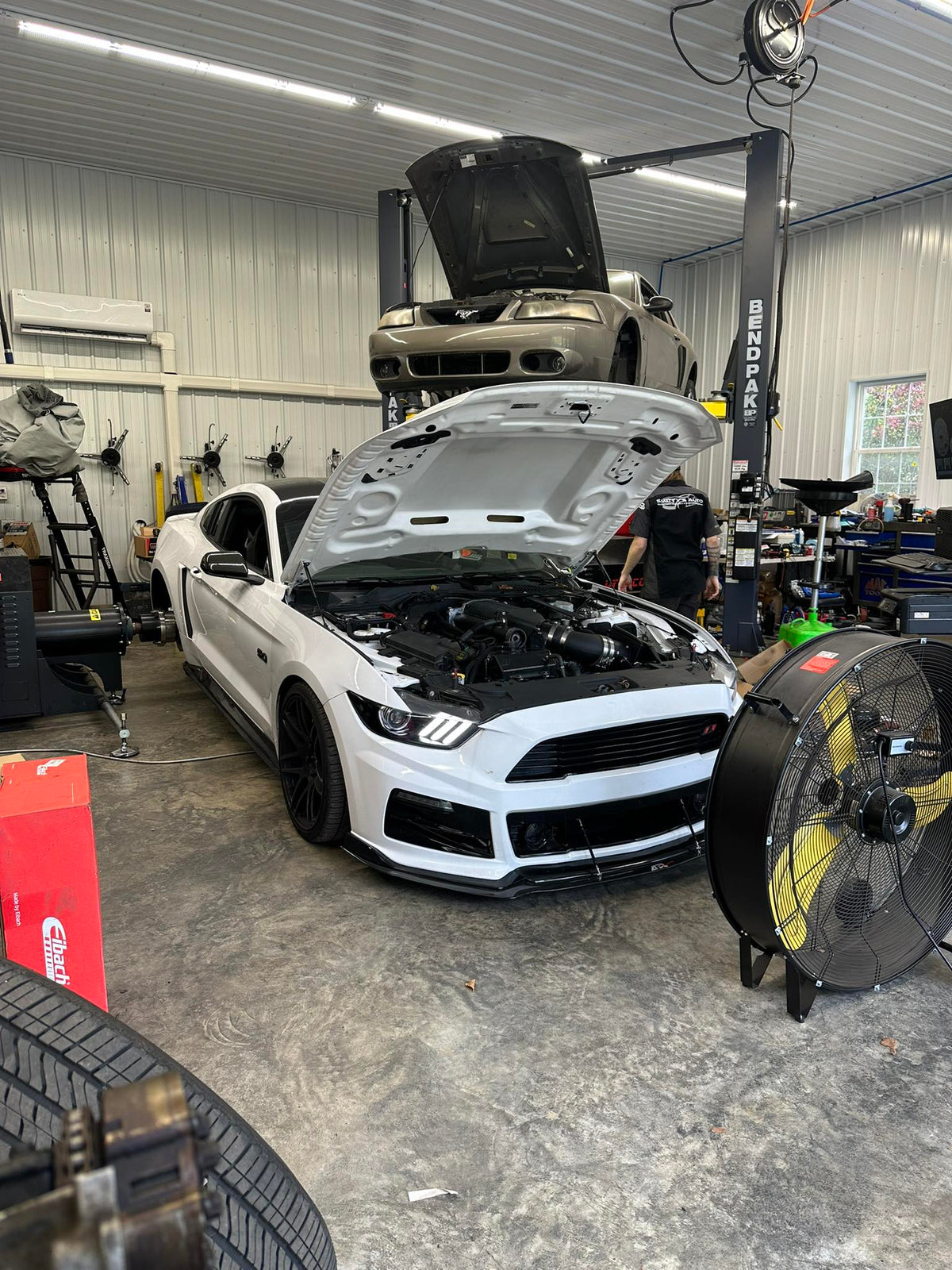 Dynocom DC TriPod testing white Mustang in professional performance shop