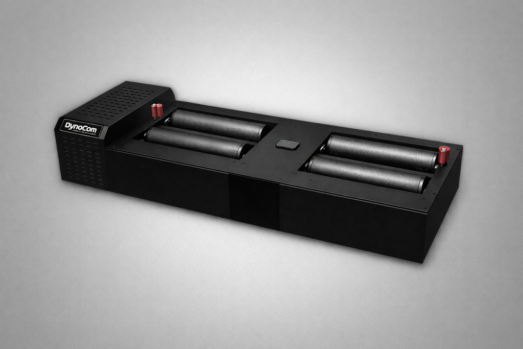 Dynocom 2WD 6000 Series cradle roll dynamometer studio shot on grey background