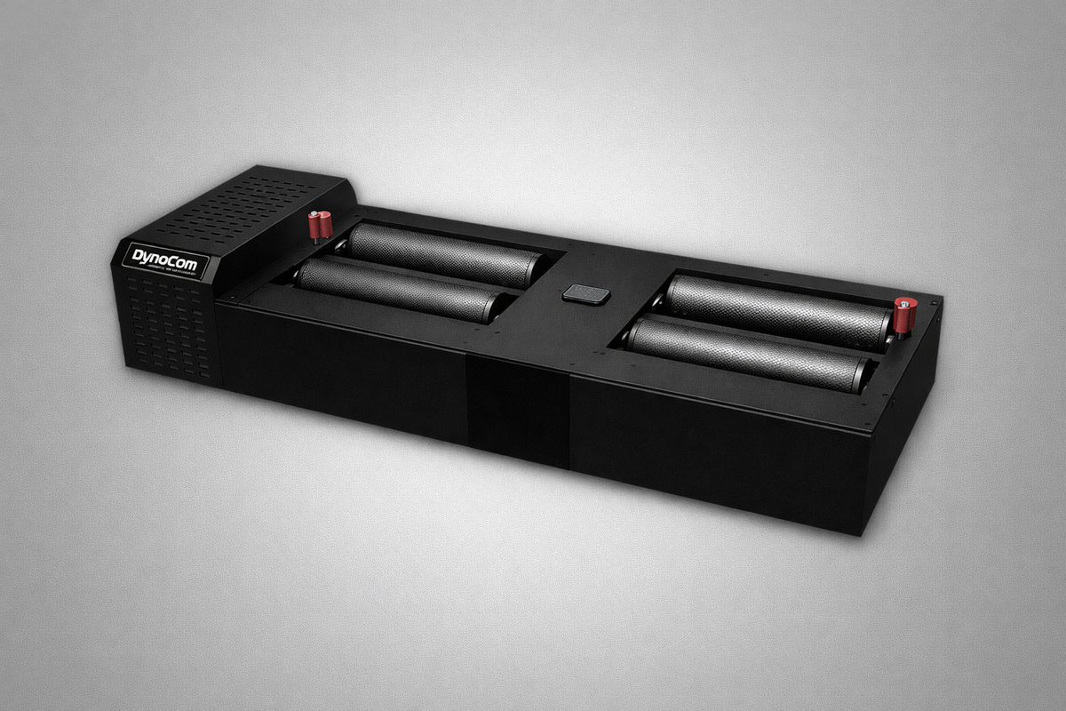 Dynocom 2WD 6000 Series cradle roll dynamometer studio shot on grey background