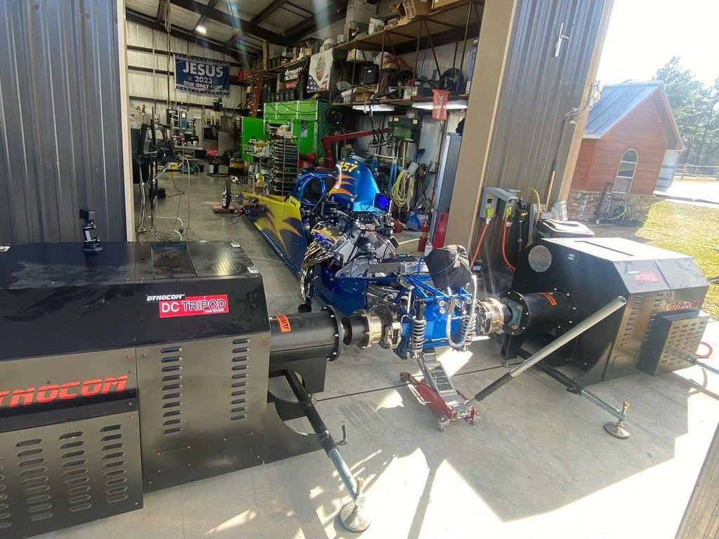 Dynocom DC TriPod testing a drag racing car in shop
