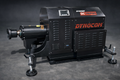 Dynocom DC Tripod 7500 Series hub dynamometer unit in black with red branding on dark studio background